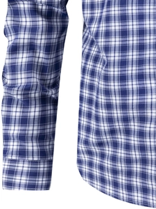Close-up detail of blue and white plaid shirt fabric texture and neat cuff stitching