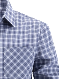 Detailed close-up of blue gingham shirt showing the bias-cut chest pocket and fine stitching