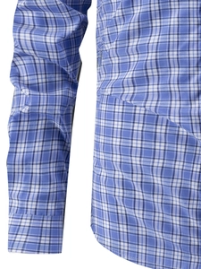 Detailed close-up showing the blue and white plaid fabric texture and stitching of the shirt