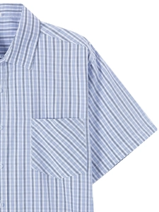 Detailed view of light blue striped shirt featuring a contrast diagonal chest pocket