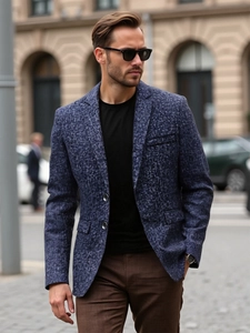 Slim fit navy blue casual blazer with textured weave and lapel for men on city street
