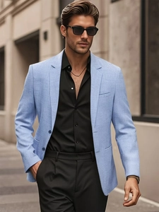 Men's light blue casual blazer with fine texture on a stylish urban street background