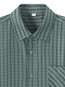 Detail of grey-green striped shirt collar with US SIZE M label and chest pocket