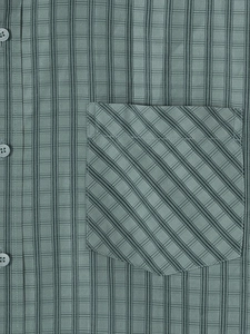 Detail of plaid shirt pocket with bias-cut texture and premium grey buttons on fabric