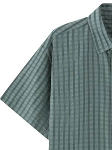 Detailed close-up of grey-green plaid fabric and collar on this men's short sleeve shirt