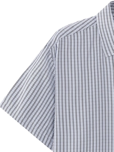 Close-up of a men's business shirt featuring a classic black vertical striped pattern