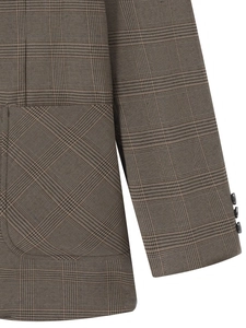 Vue détaillée du blazer marron à carreaux Glen avec poche latérale et boutons de manche