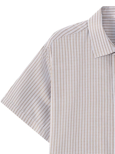 Detail of brown vertical striped texture and shoulder stitching on a men's short sleeve shirt