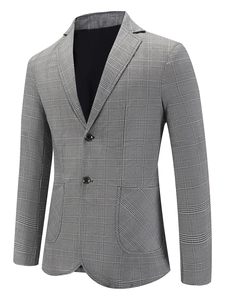 Détail du tissu à carreaux Prince de Galles et revers cranté sur blazer gris