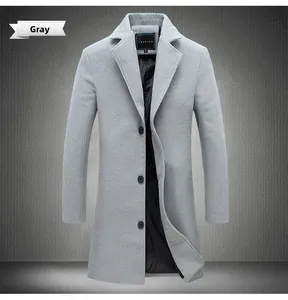 Detail view of grey wool blend overcoat showing lapel and black inner fashion brand label