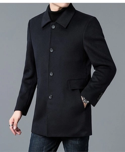 Detailed close-up of a men's black wool coat showing classic lapel and single-breasted design