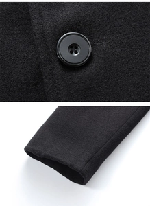 Detailed close-up of premium black wool fabric texture and reinforced four-hole button