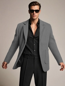 Men's grey wool blend textured suit jacket featuring classic notched lapels and side pockets