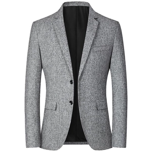 Detailed view of grey textured casual blazer featuring notch lapels and flap pockets