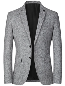 Close-up of slim fit grey blazer showing two-button closure and classic notched lapel