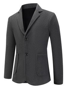Close-up of dark grey wool blend blazer showing textured fabric and patch pockets