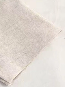 Detailed close-up showing the textured weave and natural fiber of the beige linen fabric
