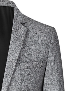 Close-up of men's slim fit grey blazer showing textured fabric collar and shoulder detail