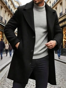 Elegant men's black mid-length trench coat with classic lapel and single-breasted design