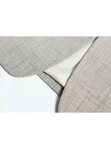 Detail of grey suit jacket hem featuring rounded edges and high-quality lining