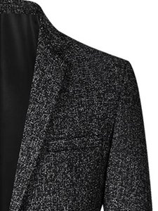 Detail of slim-fit men jacket showing notch lapel and textured polyester fabric
