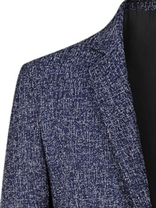 Detailed close-up of blue and white textured tweed fabric on men's slim fit blazer lapel