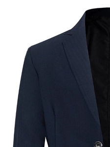 Close-up detail of navy blue blazer notch lapel and textured suit fabric finish