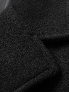 Close-up of high-quality black wool fabric texture and reinforced stitching on the collar