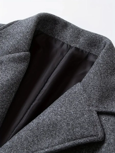 Close-up of the grey business trench coat collar showing premium wool blend texture