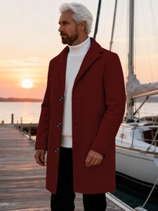 Men's wine red wool blend overcoat with lapels and buttons at sunset harbor