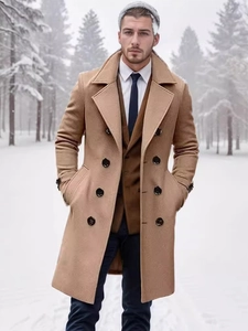 Classic double-breasted camel wool coat for men in a snowy winter forest setting