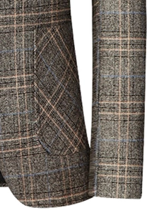 Detail of grey brown plaid blazer showing pocket tailoring and woolen wool texture