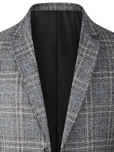 Detailed macro view of gray plaid tweed blazer featuring notch lapels and fine texture