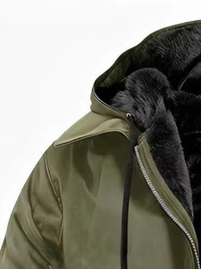 Detail of army green hooded jacket with warm black faux fur lining and drawstring adjustment