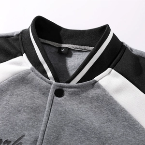 Detailed macro view of embroidered baseball jacket collar with ribbed white stripes