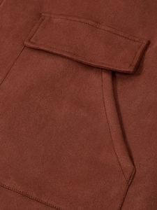 Macro shot of worker jacket pocket with thick suede fabric and detailed stitching