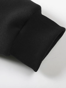 Close-up of black ribbed cuffs and premium fabric texture of the men's spring hoodie