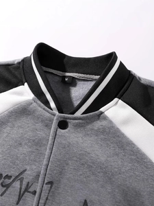 Men's athletic baseball jacket with gray color-block design and embroidered knit details