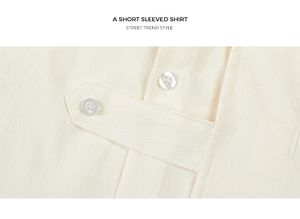 Detail of short-sleeved shirt showing the button placket and textured fabric close-up