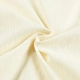 Detailed macro view of textured off-white waffle knit fabric for men's Henley shirt