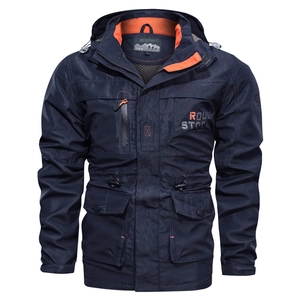 Detail of dark blue windbreaker featuring orange contrast lining and large utility pockets