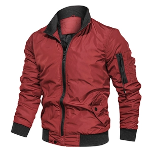 Detail view of burgundy bomber jacket featuring a utility sleeve pocket and ribbed cuffs