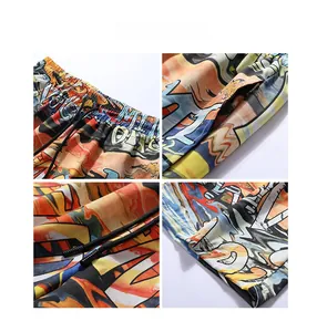 Detail view of elastic drawstring waistband and urban graffiti print on beach shorts