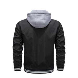 Back view of a black hooded varsity jacket with grey knit hood and striped ribbed cuffs