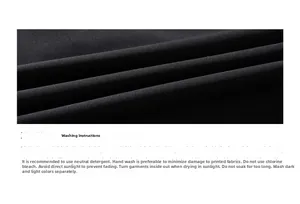 Close-up of black breathable knit fabric texture with detailed washing care instructions
