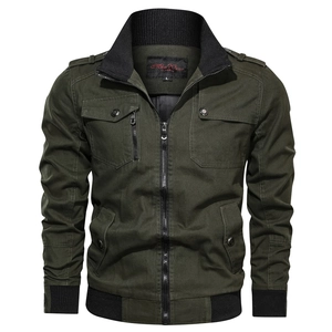 Detail of army green cotton canvas jacket showing ribbed collar and brand label on white background