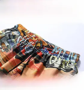 Detail of elastic waistband and black drawstring on colorful graffiti printed beach shorts