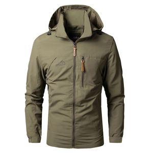 Close-up of olive green outdoor jacket featuring adjustable drawstring hood and zipper pocket