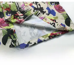 Close-up of high-quality stitching and vibrant abstract print on short sleeve shirt hem