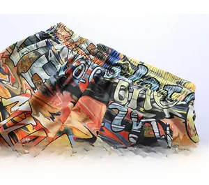 Detail of high-elastic waistband and vibrant abstract print on beach shorts